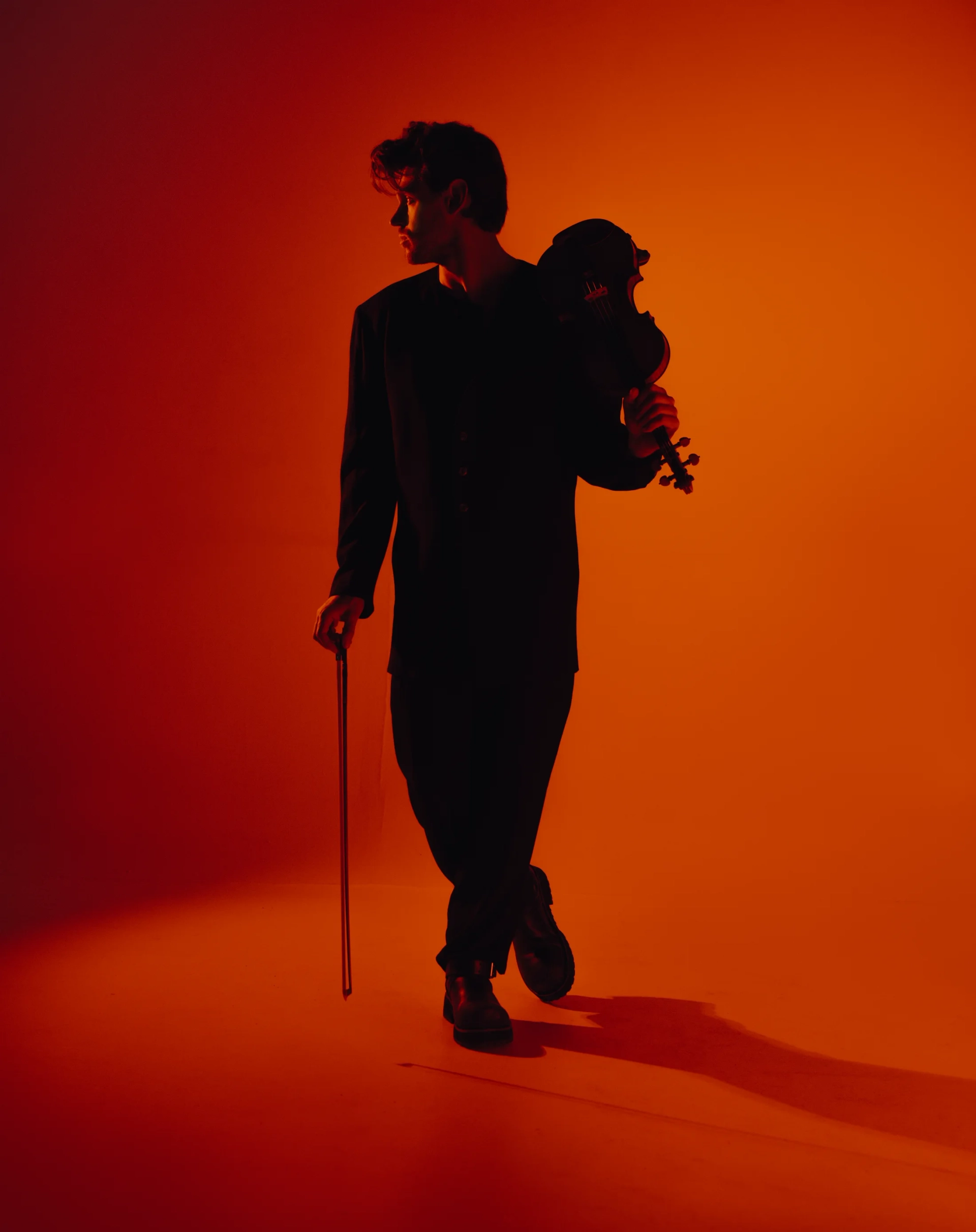 Blake Pouliot in a portrait with his violin