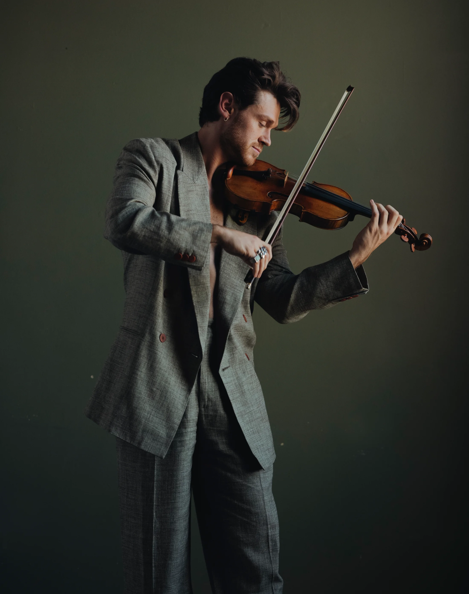 Blake Pouliot in a dark studio portrait