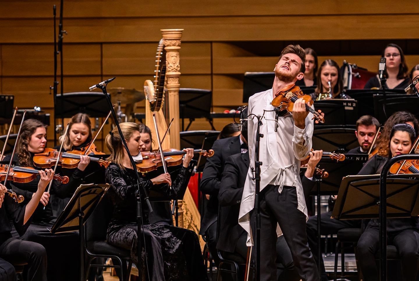 Blake Pouliot performing with an orchestra